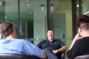 Three people sitting and talking 