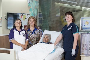 Photo of volunteers with a patient