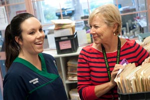 Two nurses with files