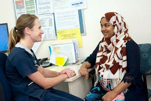 Midwife with patient