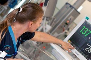 Midwife looking at monitor