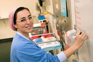 Nurse writing on white board