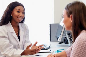 A doctor with a female patient